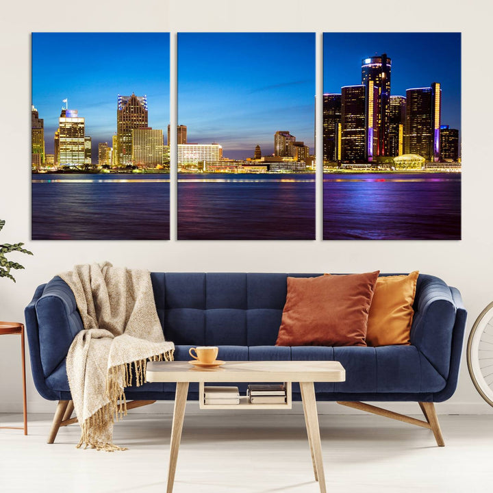 The living room features a breathtaking canvas print titled "Detroit City Lights Night Bright Blue Skyline Cityscape View," presented in a stunning triptych format on museum-quality canvases that are ready to hang.