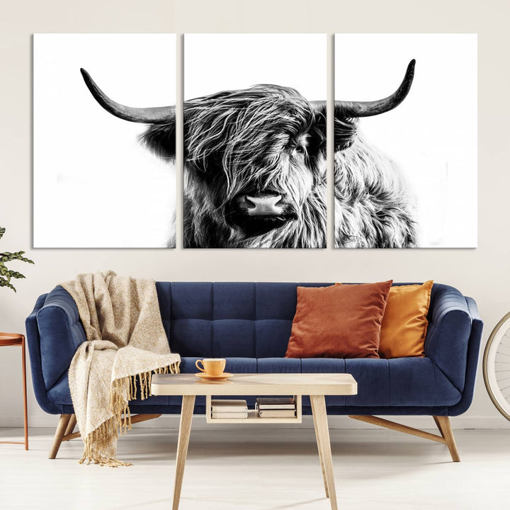 The Scottish Highland Cow Cattle Art Print Farmhouse Wall Art Canvas Print enhances rustic farmhouse decor with its depiction of a long-haired, large-horned cow. This triptych is an ideal choice for chic wall art.