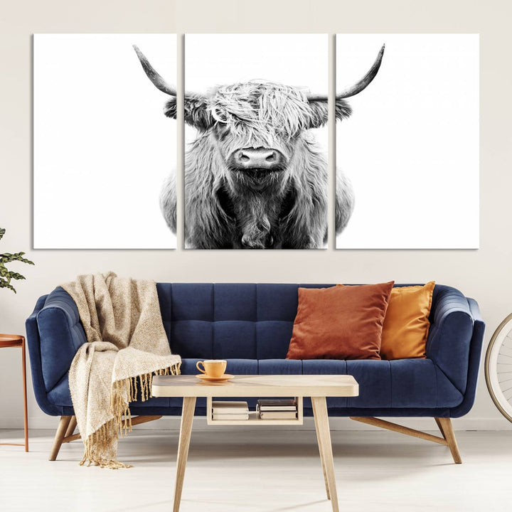 The wall art features a triptych of a Scottish Highland cow, printed on museum-quality canvases with a UV-protective coating. This decorative piece is known as the Highland Cow Canvas Wall Art Farm House Wall Art.