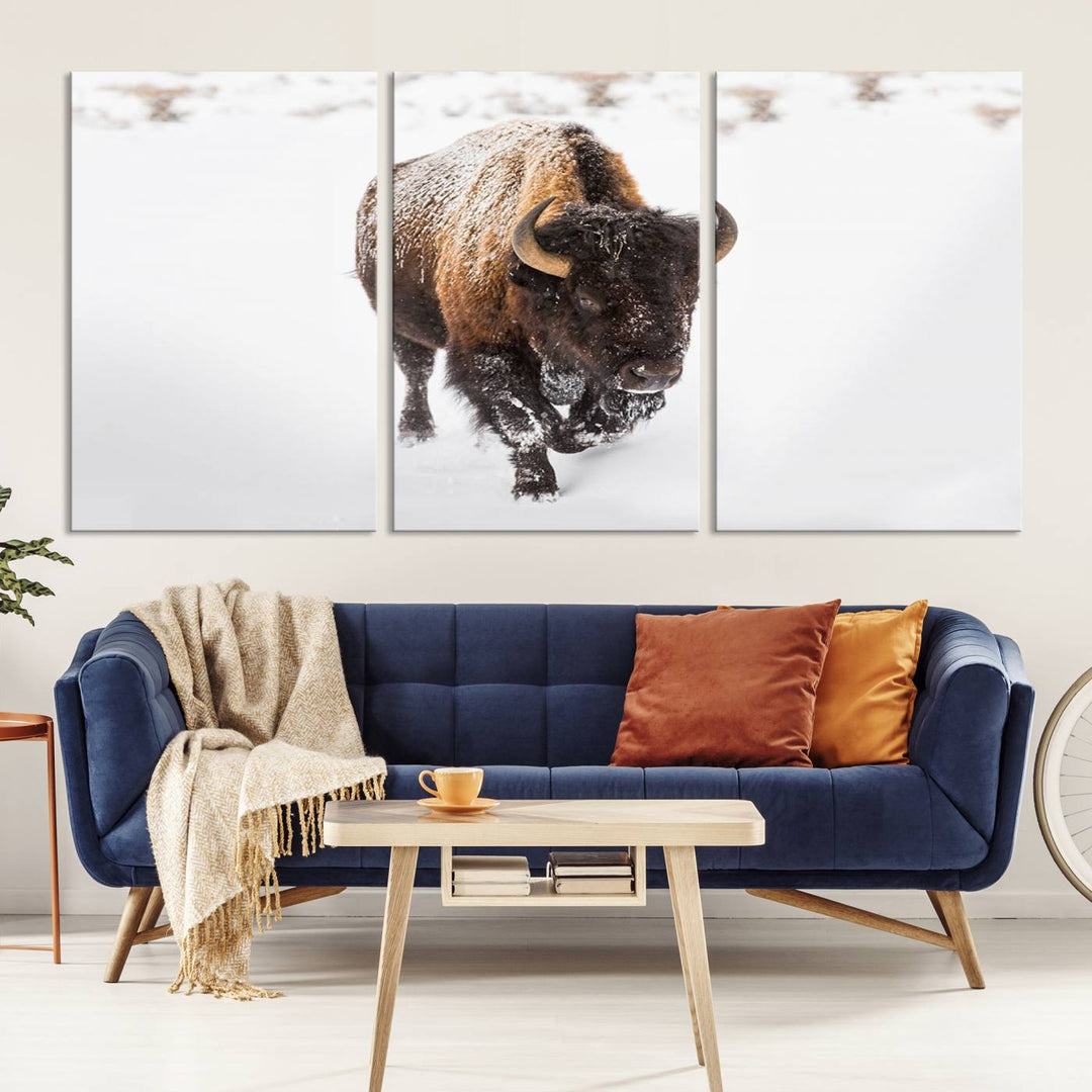 The Bison Winter Wall Art Canvas Print for Farmhouse Decor is displayed as a triptych in the living room. This artwork, printed on museum-quality canvases with a UV-protective coating to maintain its vibrant colors, is the focal point of the space.