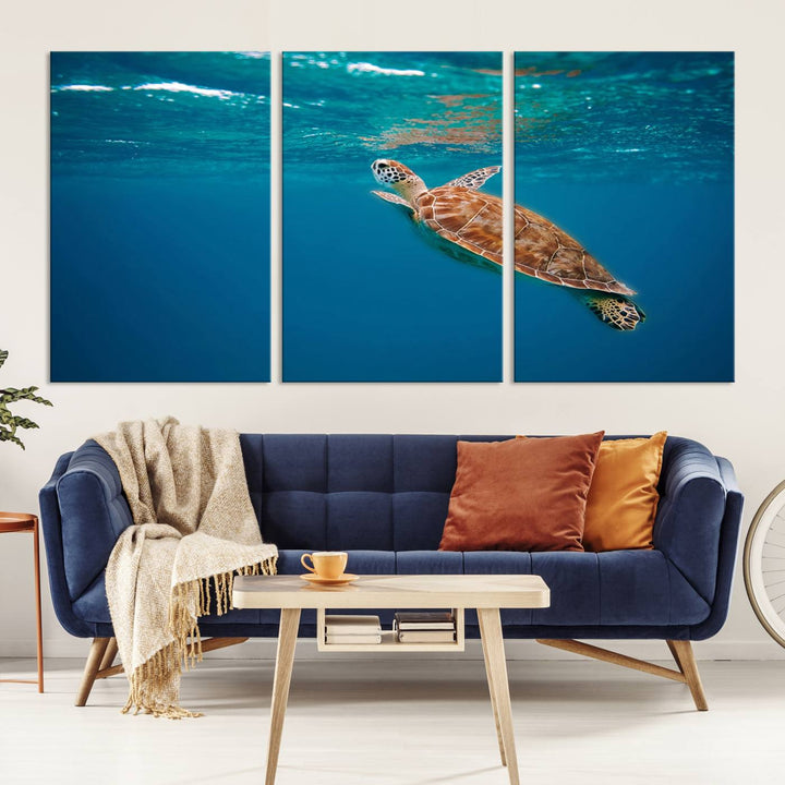 The living room features the "Baby Turtle in Ocean" wall art canvas print. This gallery-quality piece, depicting a sea turtle swimming underwater, adds an elegant touch to the space.