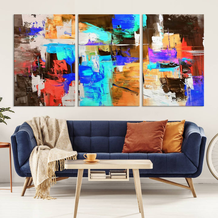 In a modern living room, the "Colorful Abstract Wall Art Canvas Print" serves as a stunning triptych centerpiece on museum-quality canvas, ready to hang. Its UV-protective coating ensures enduring vibrancy.