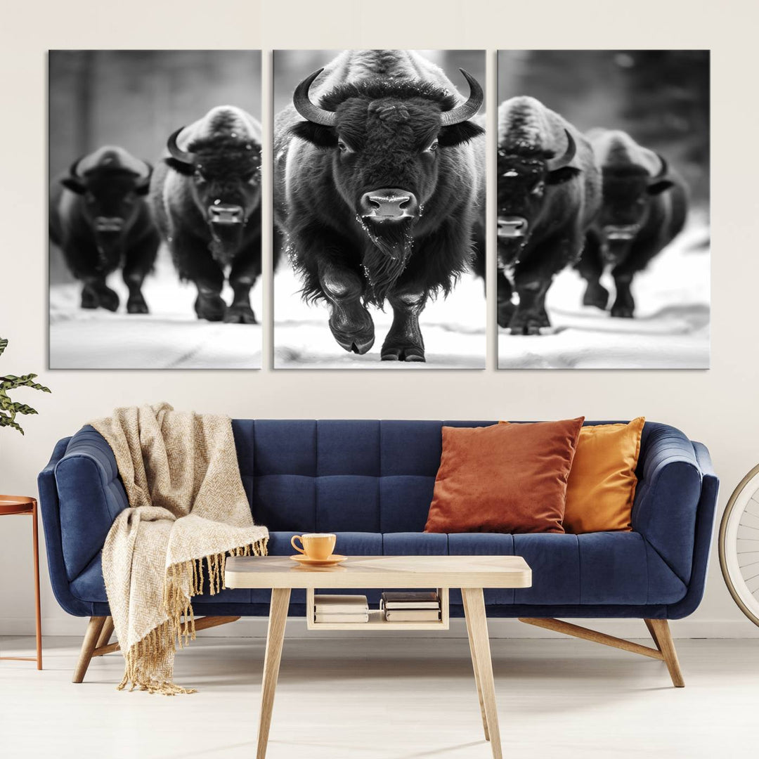 A modern living room features a striking black-and-white American Bison Art | Buffalo Herd Wall Art Canvas Print on the wall.