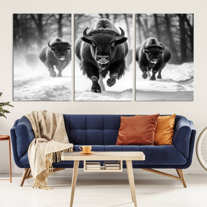 Transform your living room with the Buffalo Wall Art Canvas Print triptych, showcasing a bison family in motion across a snowy landscape. This striking Western decor piece becomes the focal point of any room.