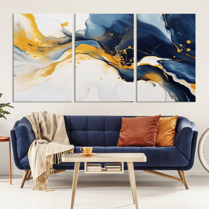 The Blue and Gold Abstract Fluid Canvas Art, with its swirling patterns, adorns the wall. This modern wall art beautifully complements the contemporary interior decor, adding an elegant touch with its rich blue, gold, and white tones.