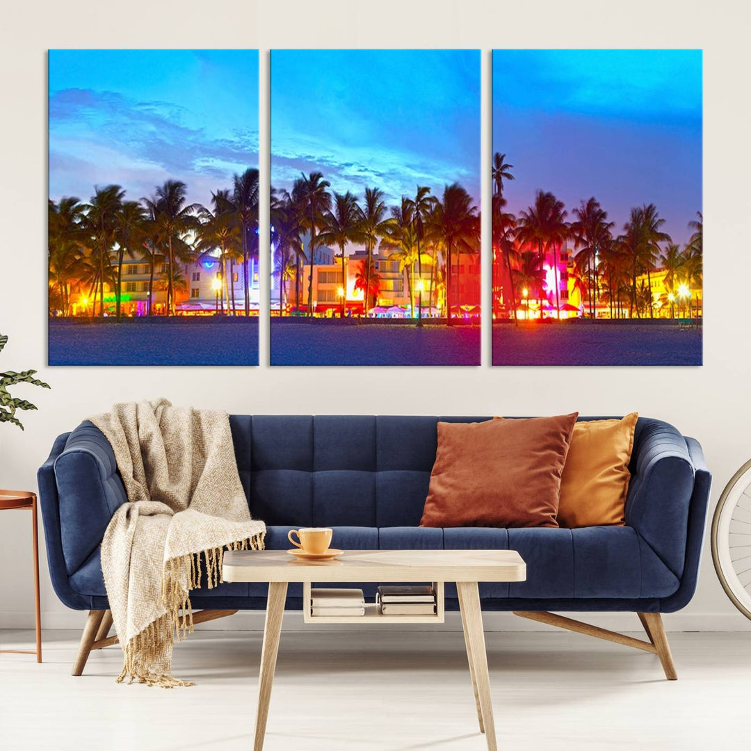 The living room features a three-panel Miami City Wall Art Canvas Print, showcasing a colorful, illuminated beach scene with palm trees on museum-quality canvas.