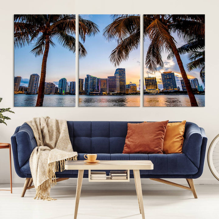 The Wall Art MIAMI Canvas Print features a triptych design depicting palm trees and a city skyline at sunset.