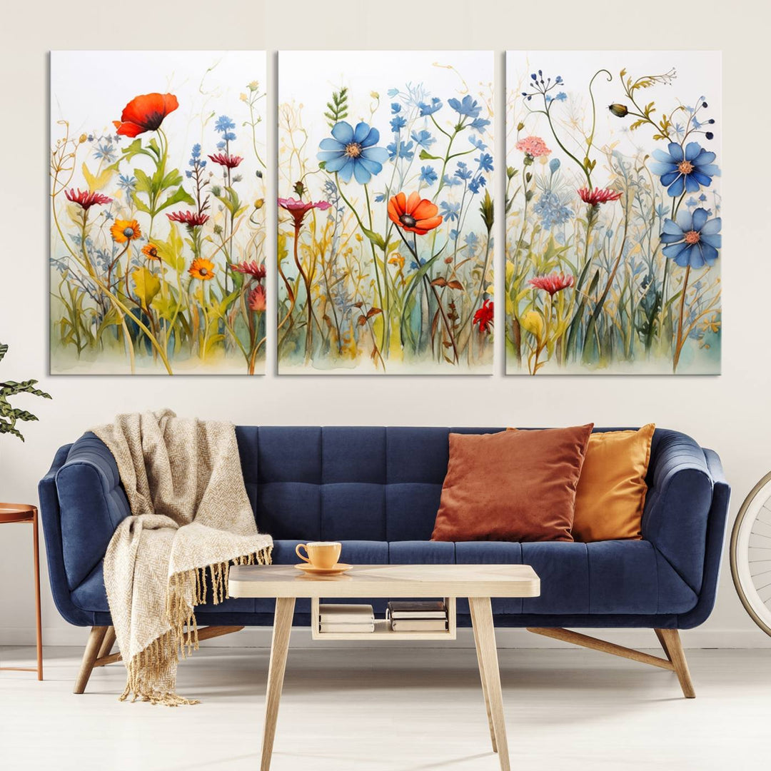 The Colorful Wildflower Canvas Wall Art – Vibrant Floral Botanical Print, consisting of a large 3 panel set, adds bright nature decor to the living room against a black wall.