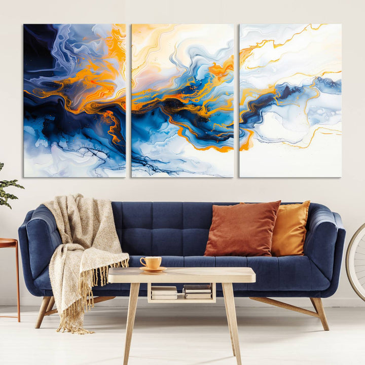 A stunning Fluid Alcohol Ink Wall Art with Gold Wall Art Canvas Print, featuring vibrant blue, orange, and white swirls, adorns the wall. This gallery-quality finish adds an exquisite touch to any living space.