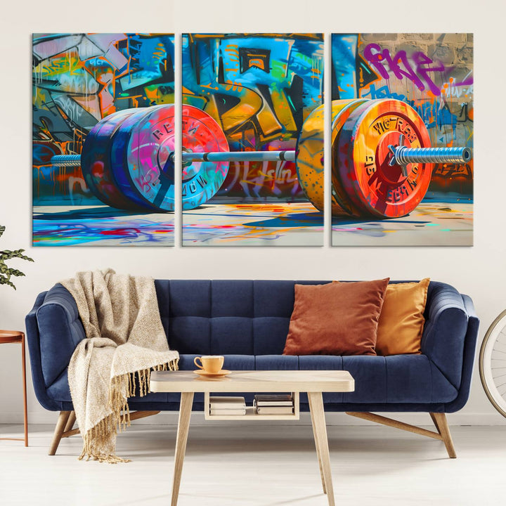 The Fitness Gym Barbell Graffiti Wall Art Canvas Print, a vibrant triptych featuring a barbell against a graffiti backdrop, elegantly hangs in the room. Crafted on premium canvas with a gallery-quality finish, this stunning piece of wall art effortlessly combines urban flair with sophisticated decor.