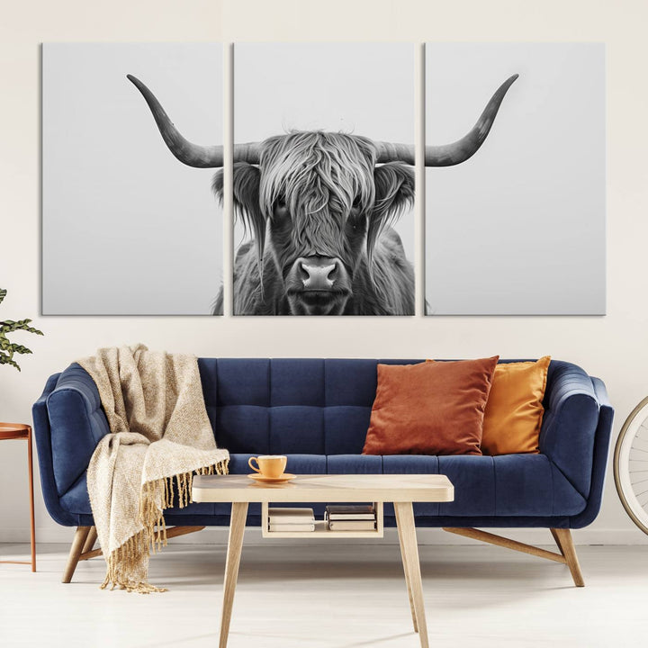 A triptych titled "Farmhouse Longhorn Wall Art Canvas Print, Longhorn Texas Wall Art Canvas Print," rendered in a gallery-quality finish, hangs prominently on the wall.