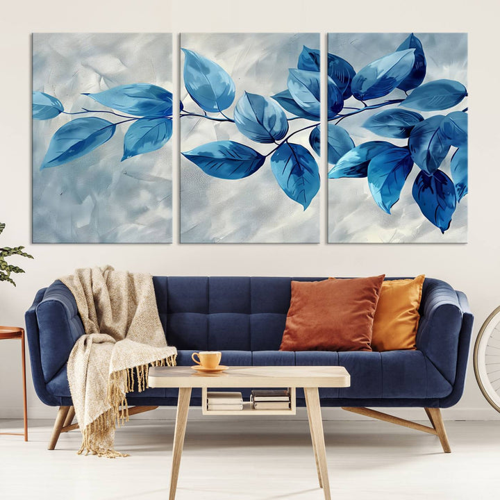 A Blue Leaf Abstract Wall Art Canvas Print, featuring a textured background and gallery-quality finish, is displayed.