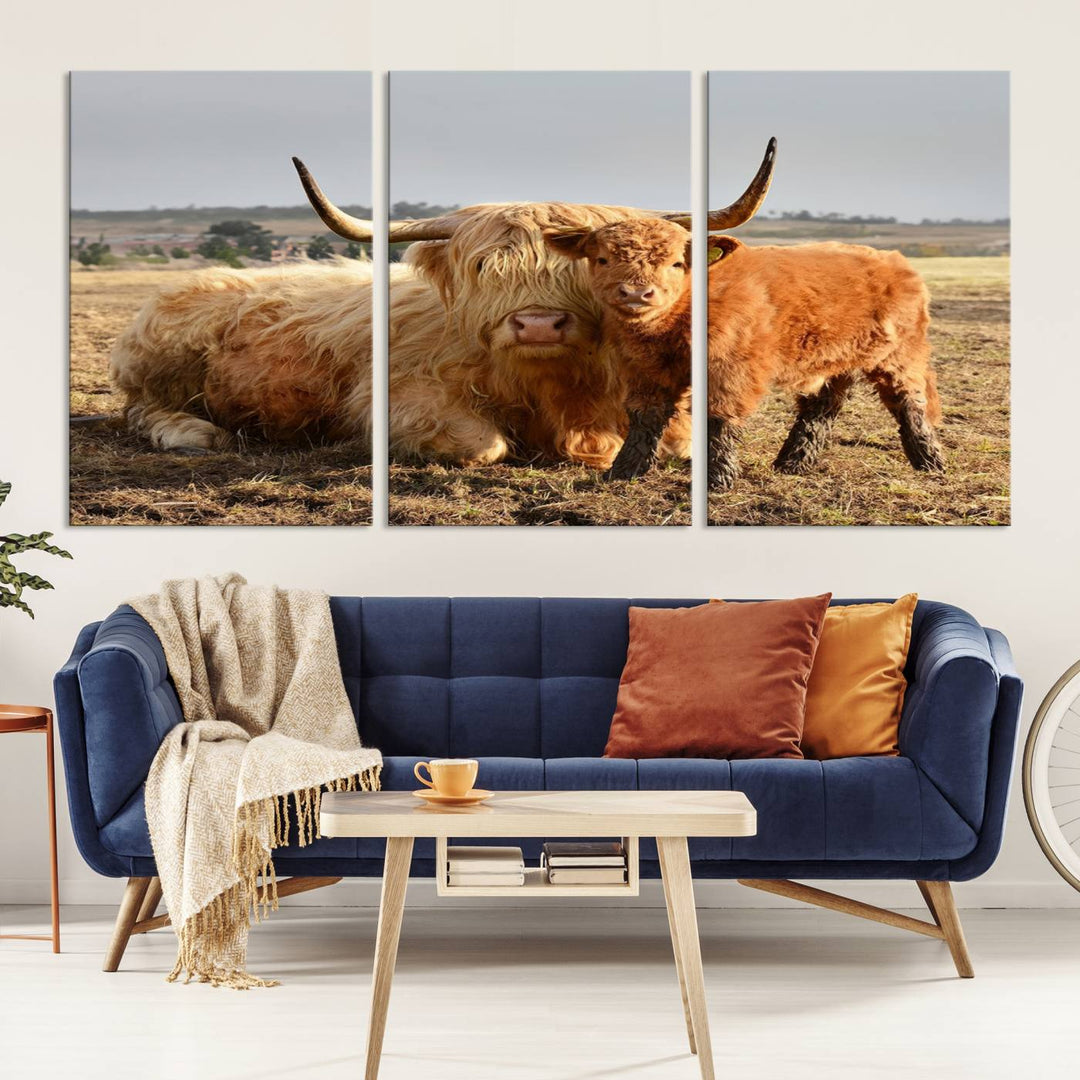 The three-panel canvas artwork, titled "Highland Cow Canvas Wall Art Animal Print for Farm House Decor," features a serene scene of a resting Highland cow and calf in a field. The piece highlights its gallery-quality finish.