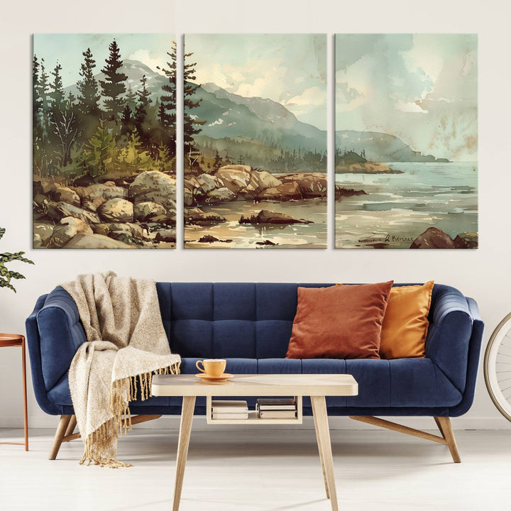 The living room features a breathtaking three-panel Abstract Acadia National Park Wall Art Canvas Print, which beautifully captures the rocky Maine coastline with trees and mountains.