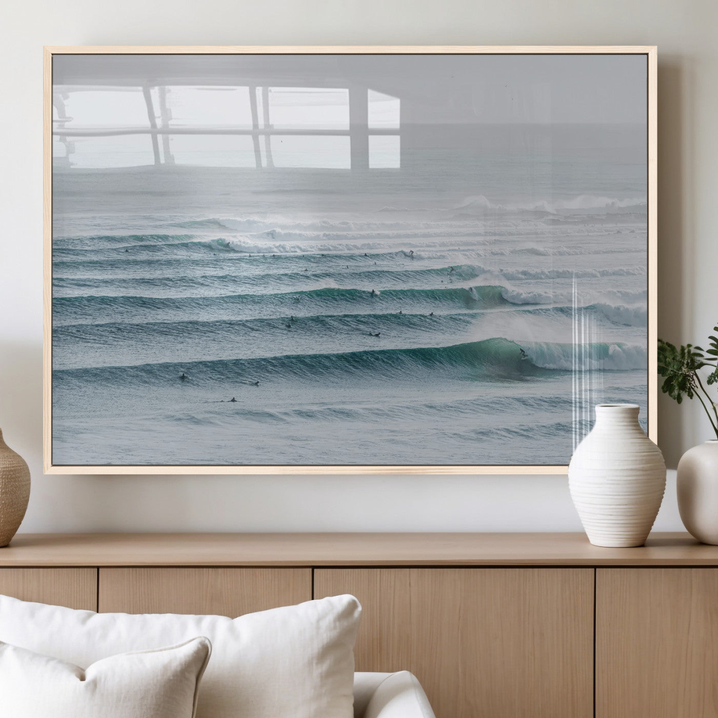High-angle view of surfers lining up across layered ocean waves, ideal for minimal coastal or surf-inspired room decor.