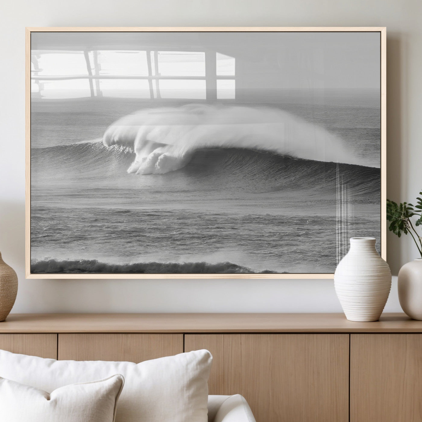 A dramatic black and white ocean wave crashing with immense force, capturing the raw power and movement of the sea in a bold seascape.