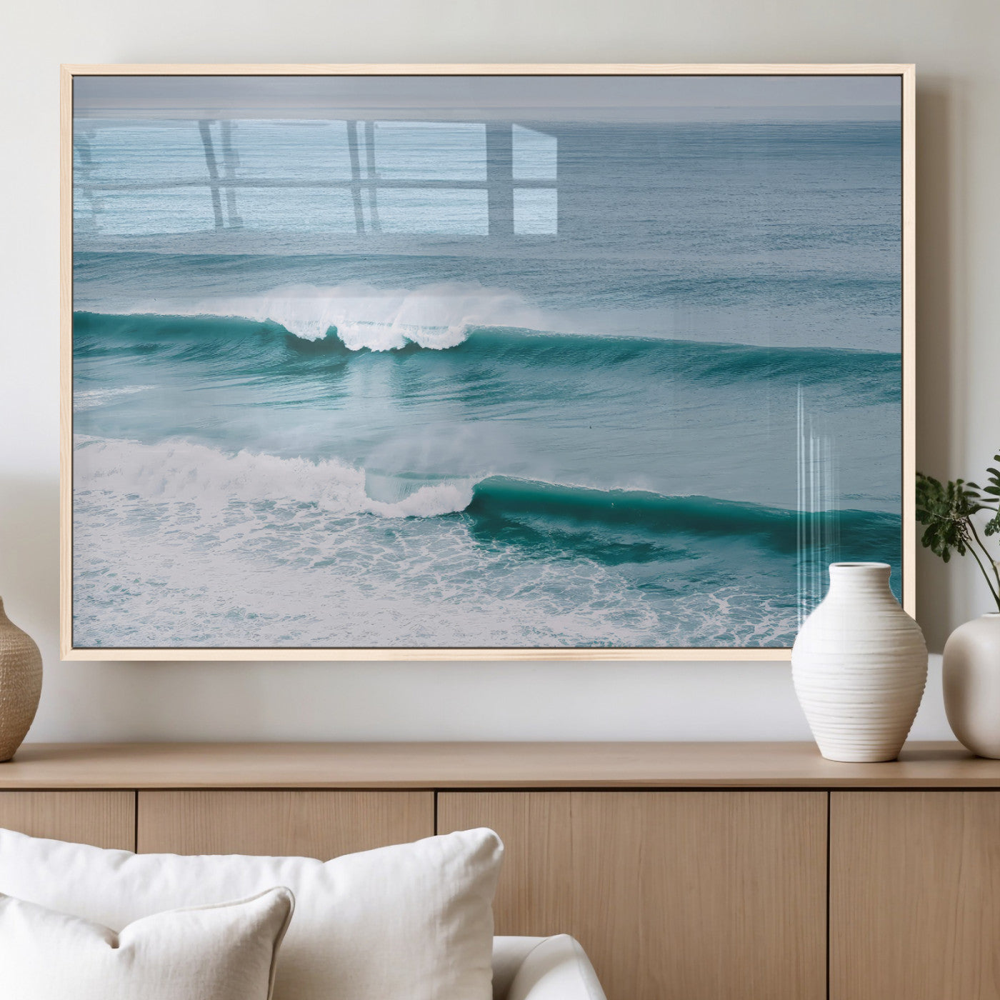 Powerful ocean waves rolling towards the shore, their turquoise hues blending with white sea foam under an open horizon, capturing the essence of the ocean's movement.