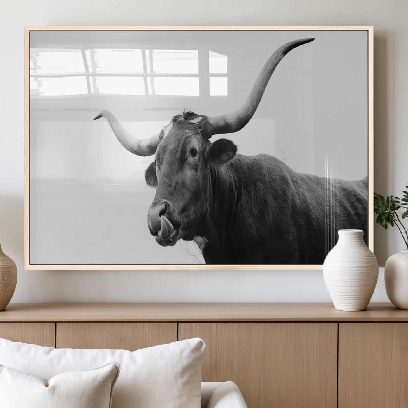 Black and white photo of a Texas Longhorn cow with curved horns, ideal for rustic, western or minimalist style home decor.