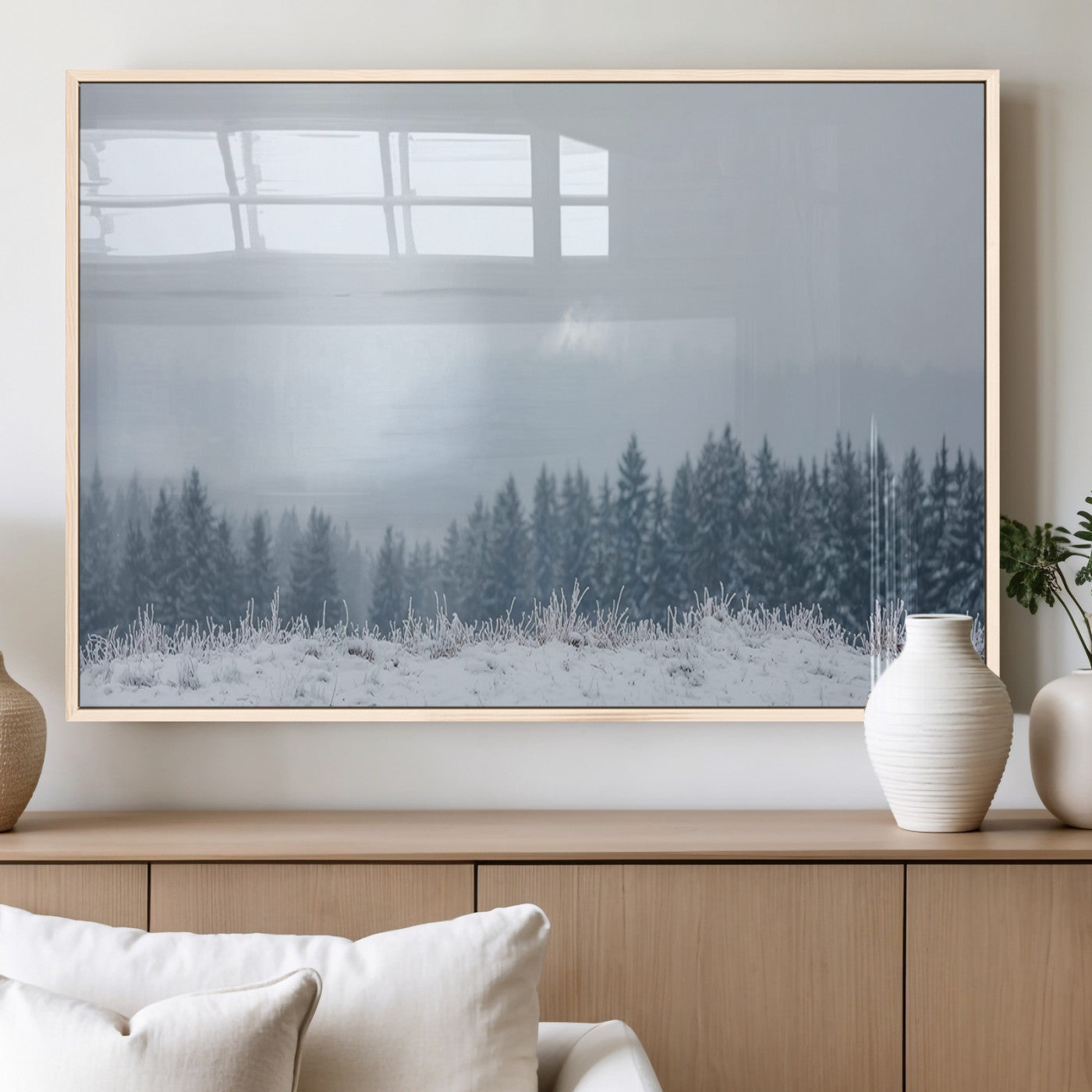 Snow-covered forest under misty sky, soft light breaking through clouds, ideal for minimalist or Nordic-inspired home decor.