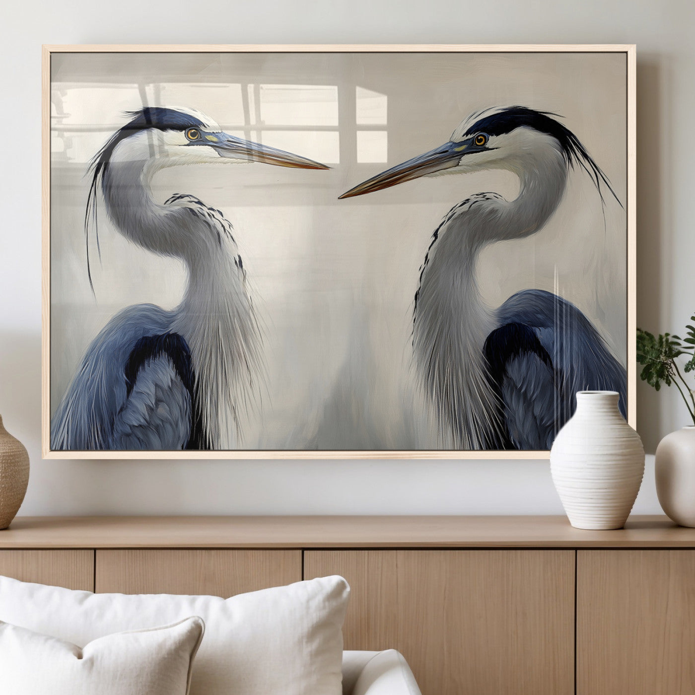 Two blue herons facing each other on a soft neutral background, ideal for coastal, tranquil, or nature-inspired minimalist interiors.