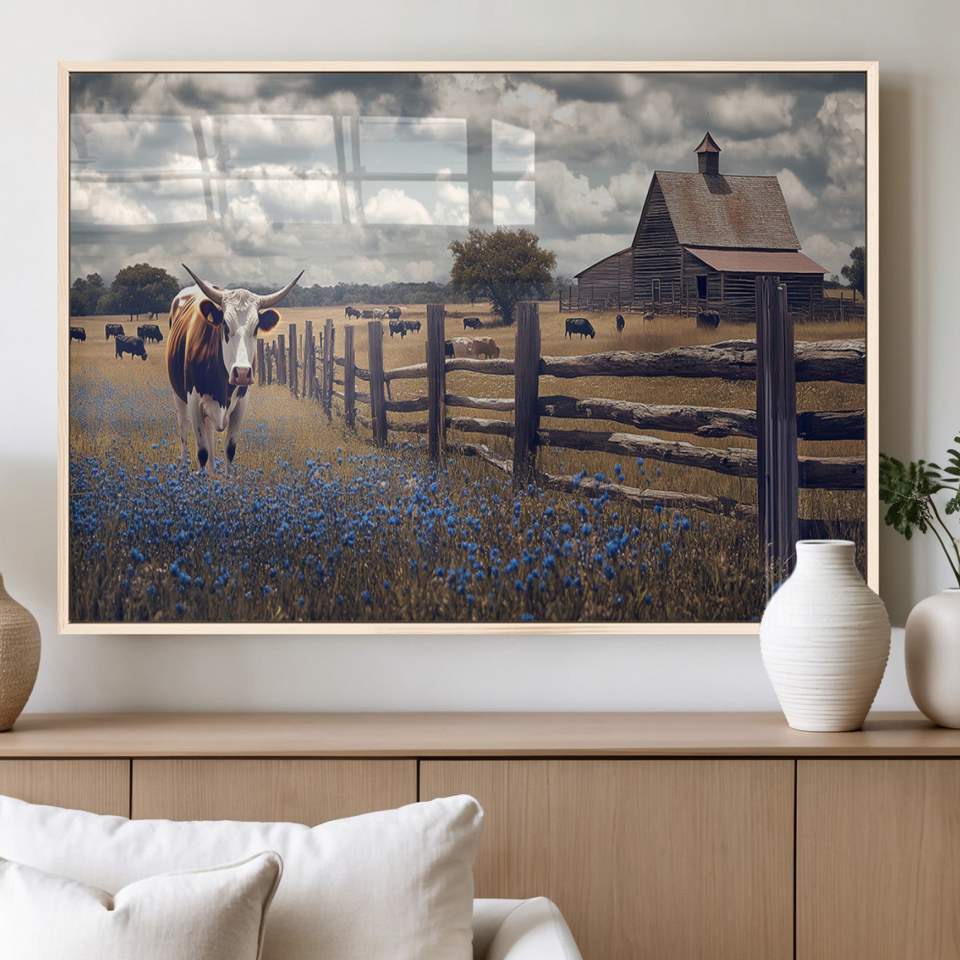 Framed canvas print of a Texas Longhorn near a rustic barn and fence, ideal for farmhouse or western-style home wall decor.
