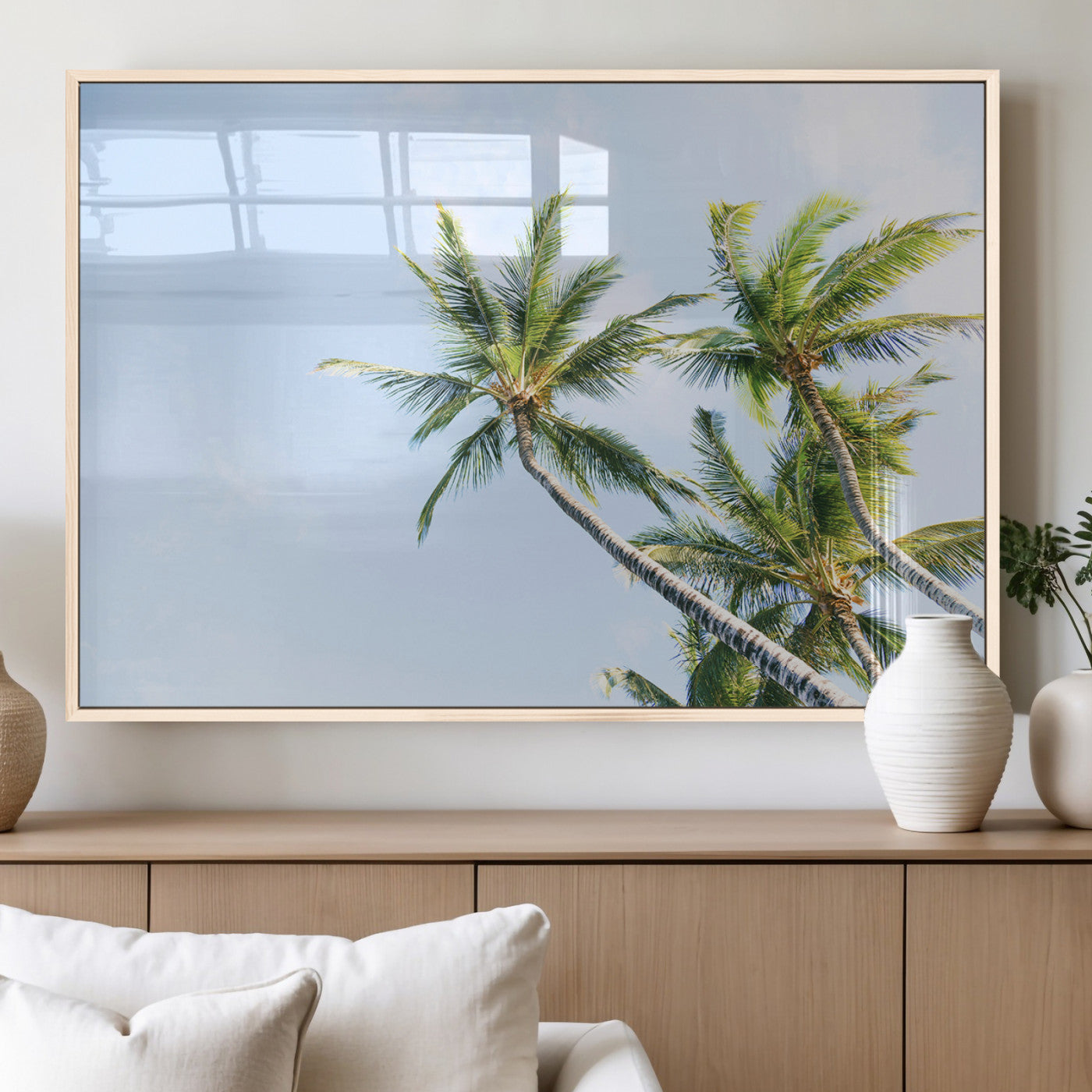 Tall palm trees swaying under a bright blue sky, capturing a tropical and minimalist beach vibe, perfect for coastal-inspired wall art.