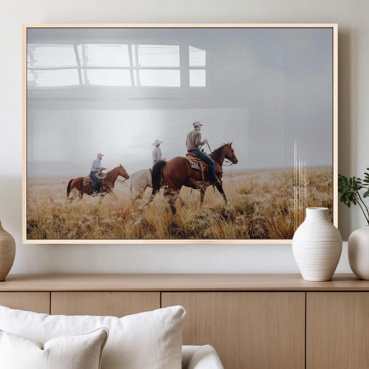 Three cowboys riding horses through a foggy prairie landscape, dressed in Western attire, evoking a rustic and adventurous Wild West aesthetic.