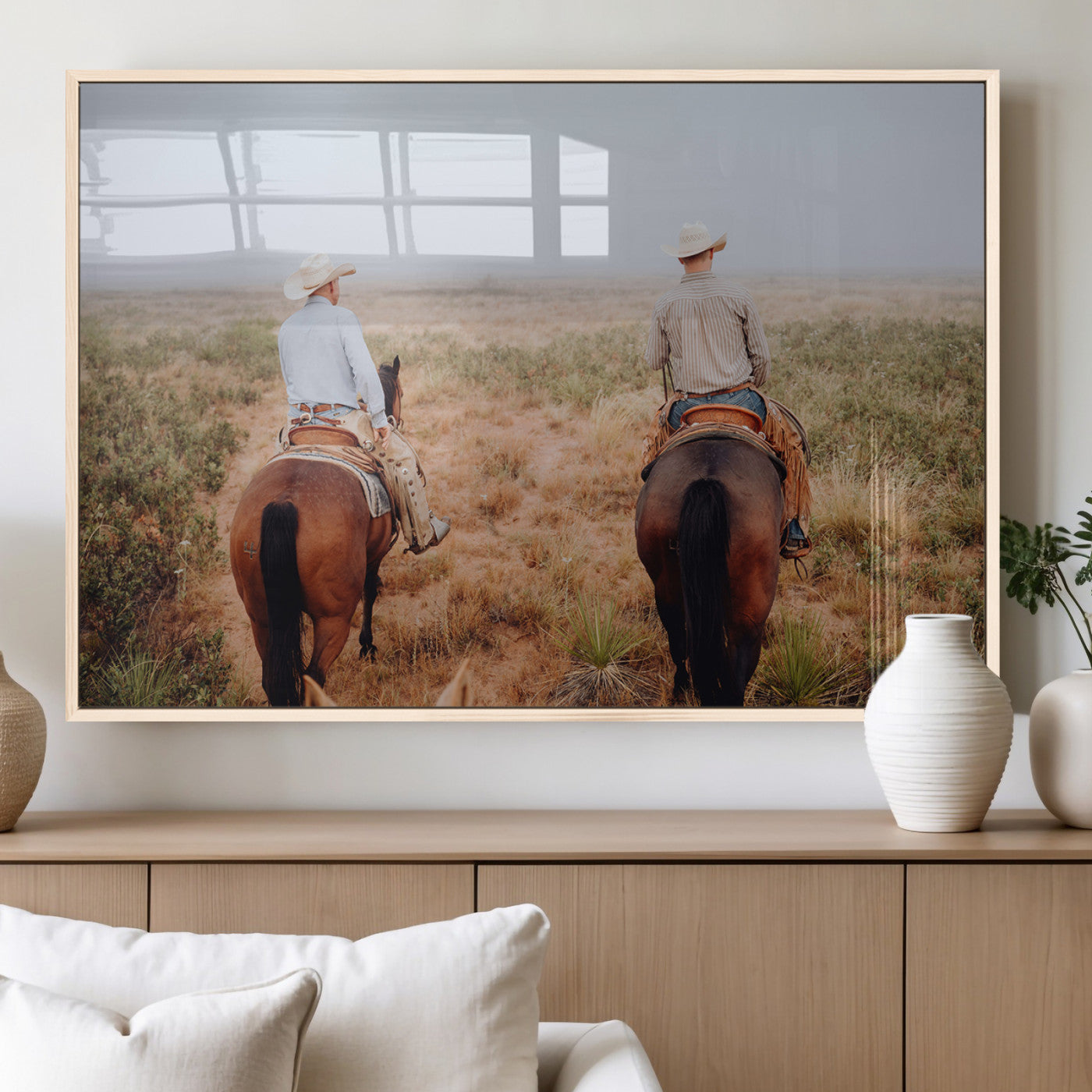 Two cowboys riding horseback through a misty prairie, capturing the rustic and adventurous spirit of the Western frontier.