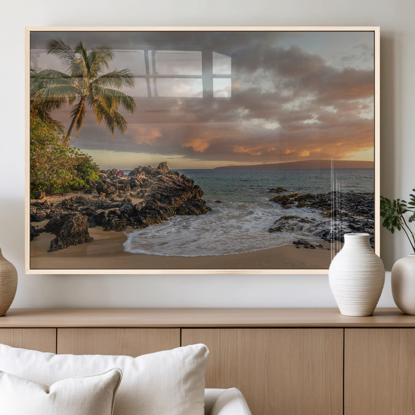 Golden sunset over a tropical beach with palm trees, rocky shoreline, and gentle ocean waves, perfect for coastal and island-inspired decor.