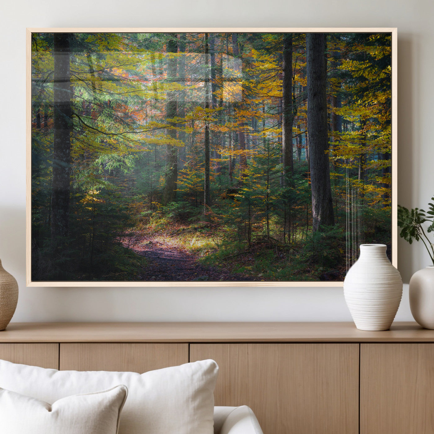 A serene autumn forest with golden and green leaves, a misty atmosphere, and a sunlit pathway, creating a tranquil nature-inspired wall art piece.