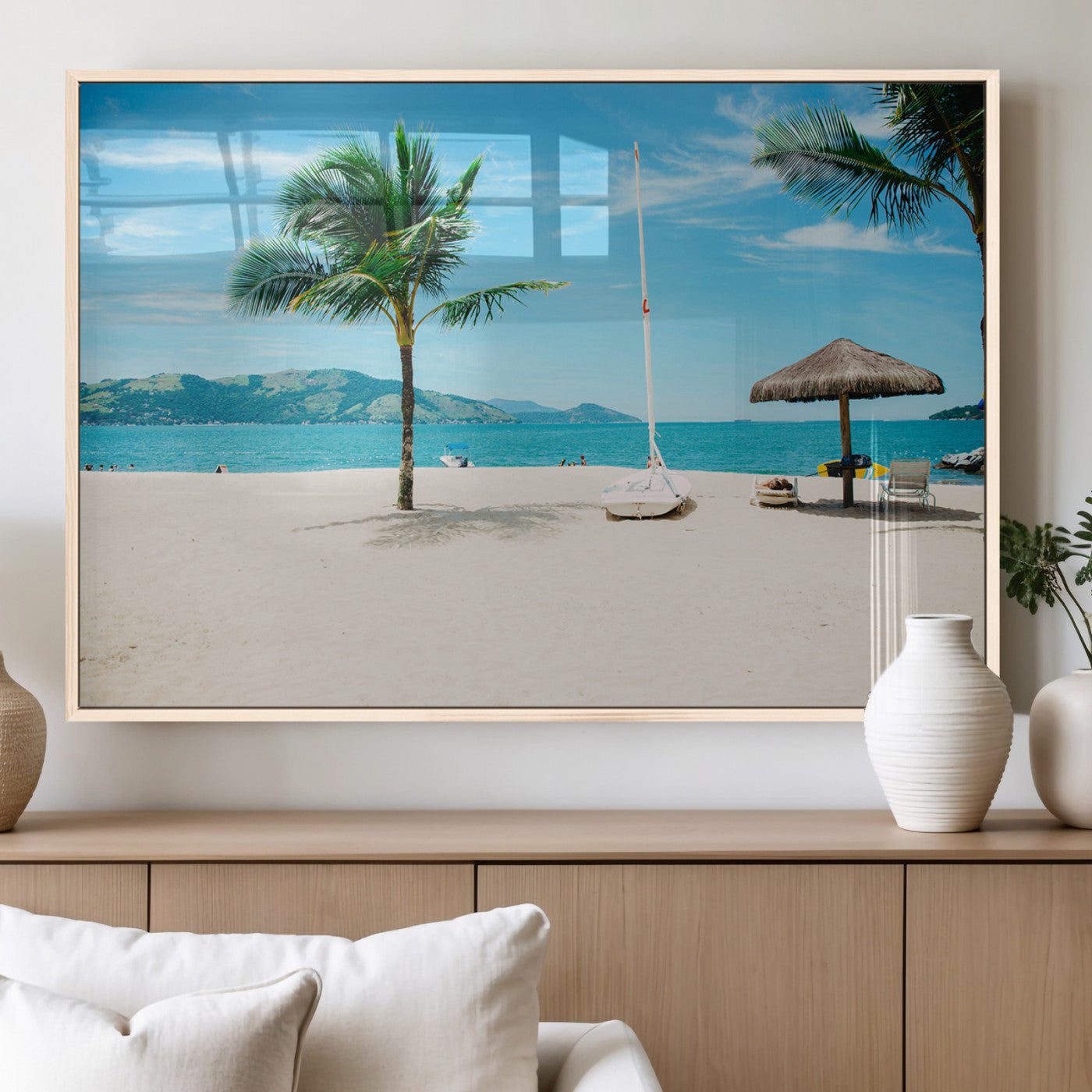 Tropical beach scene with palm trees, a white sailboat, and turquoise ocean waters under a bright blue sky, creating a peaceful summer vibe.