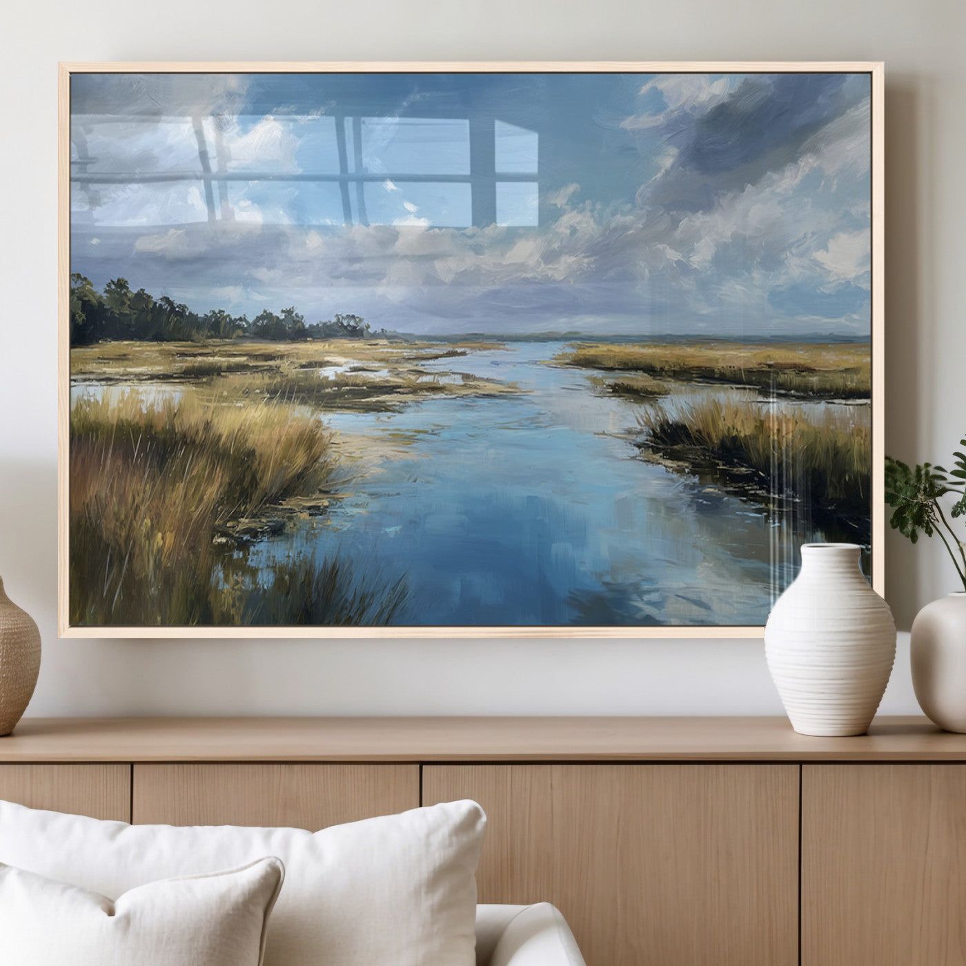 A beautiful, painterly landscape of a calm river winding through a marsh, with vibrant green grasses and a bright blue sky filled with fluffy clouds.