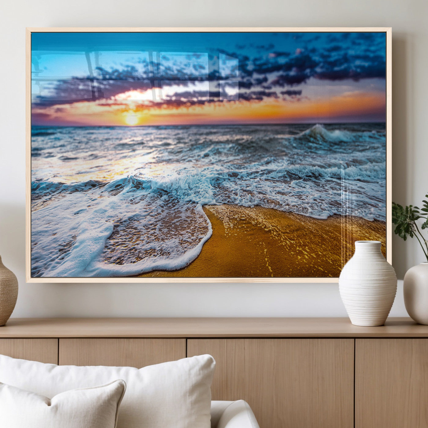 Beautiful ocean shoreline at sunset with foamy waves washing onto golden sand under a colorful sky – Wall Art Canvas Print.