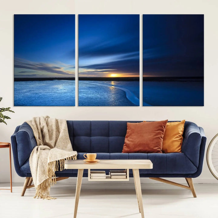 The living room features a triptych of the Wall Art Canvas Print Navy Sunset Lake Landscape Artwork, adding to its tranquil vibe.