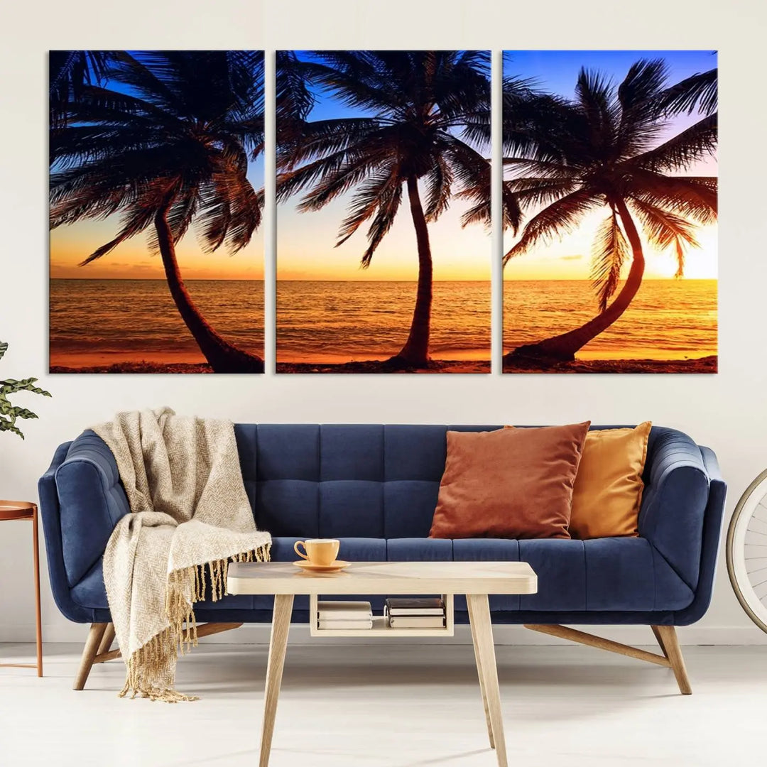 The living room features a wall adorned with the "Wall Art Canvas Curve Palms at Sunset on Beach," showcasing gallery-wrapped, museum-quality canvases in a stunning triptych.