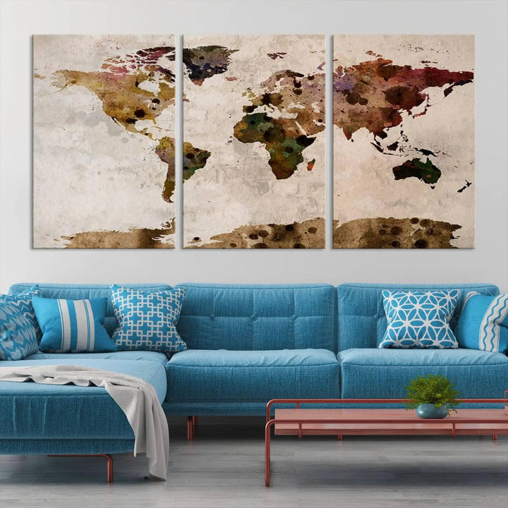 A Watercolor World Map Canvas Print, wrapped in an elegant gallery style, hangs on the wall.