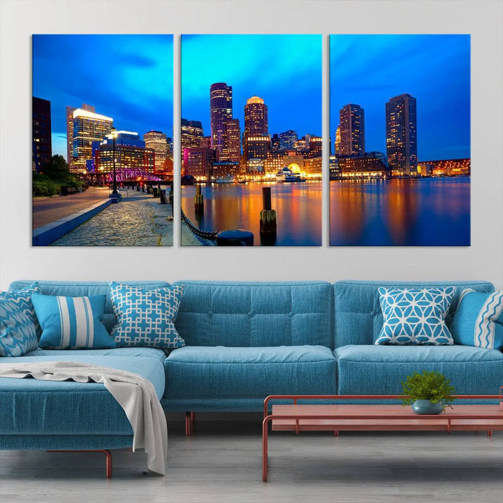 A triptych of the "Boston City Lights Night Blue Skyline Cityscape View Wall Art Canvas Print" adorns the wall. This museum-quality canvas artwork is ready to hang and includes a UV-protective coating for lasting brilliance.