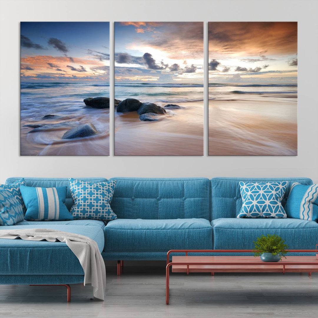 The "Serene Weather On The Beach Wall Art Canvas Print," featuring a tranquil beach scene with rocks and waves, is ready to hang and enjoy.