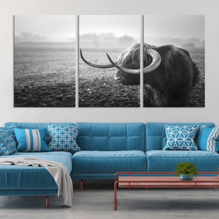 The living room features a three-panel wall art of a highland cow in a foggy field, using the Cow Wall Art Canvas Print for visual impact. This museum-quality canvas includes UV-protective coating to ensure longevity.