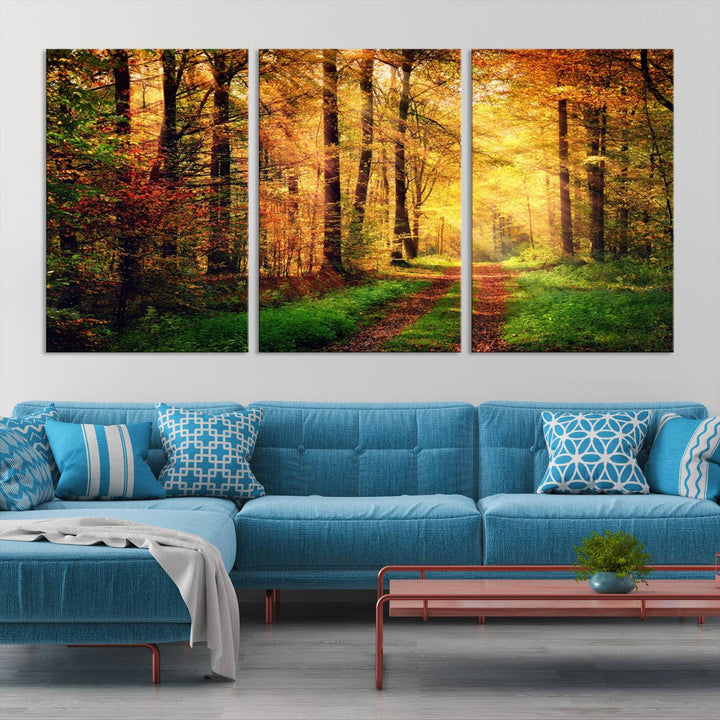 The Sunlight Through Trees Wall Art Canvas Print showcases a sunlit forest path in autumn on gallery-wrapped, museum-quality canvas with UV-protective coating.