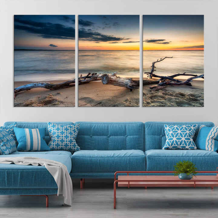 A captivating piece of Ocean Sunset Beach Wall Art Canvas Print, gallery wrapped, graces the gray wall.