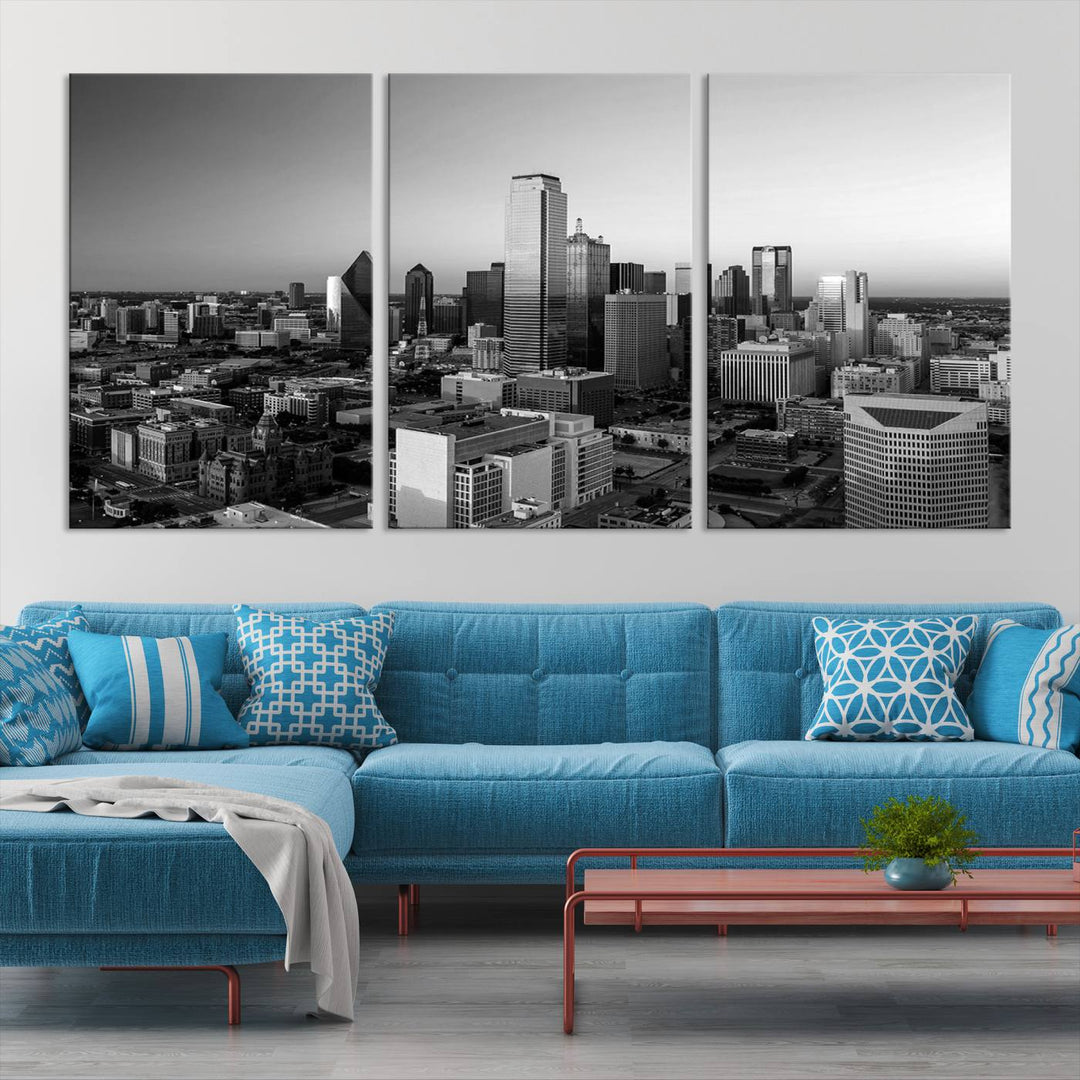 A modern living room showcases the Dallas City Lights Skyline Black and White Wall Art Cityscape Canvas Print. This gallery-wrapped piece offers a sleek finish and is crafted from museum-quality pollycotton. It features a UV-protective coating to ensure lasting vibrancy.