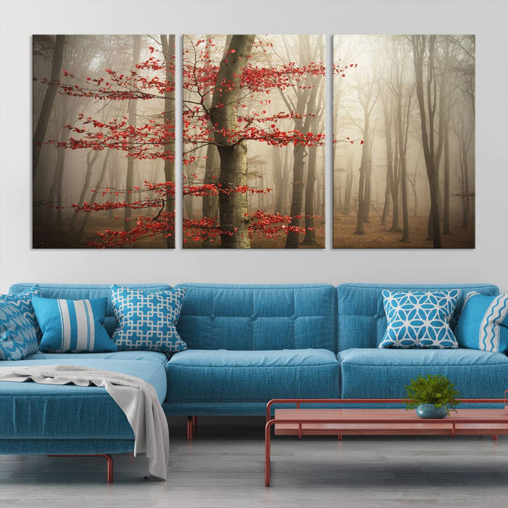 The living room features the Foggy Forest Wall Art, an Autumn Trees Canvas Print that showcases a serene nature scene with foggy woodland decor and a tree adorned in vibrant red leaves.