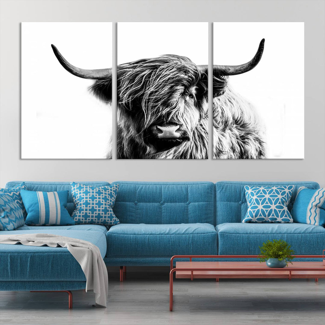 The Scottish Highland Cow Cattle Art Print Farmhouse Wall Art Canvas Print enhances rustic farmhouse decor with its depiction of a long-haired, large-horned cow. This triptych is an ideal choice for chic wall art.