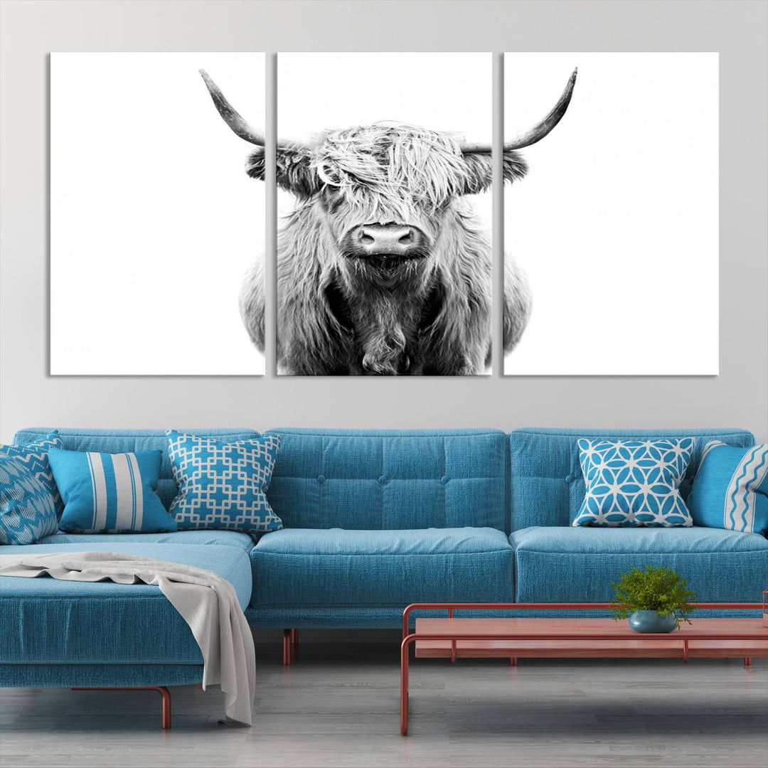 The wall art features a triptych of a Scottish Highland cow, printed on museum-quality canvases with a UV-protective coating. This decorative piece is known as the Highland Cow Canvas Wall Art Farm House Wall Art.