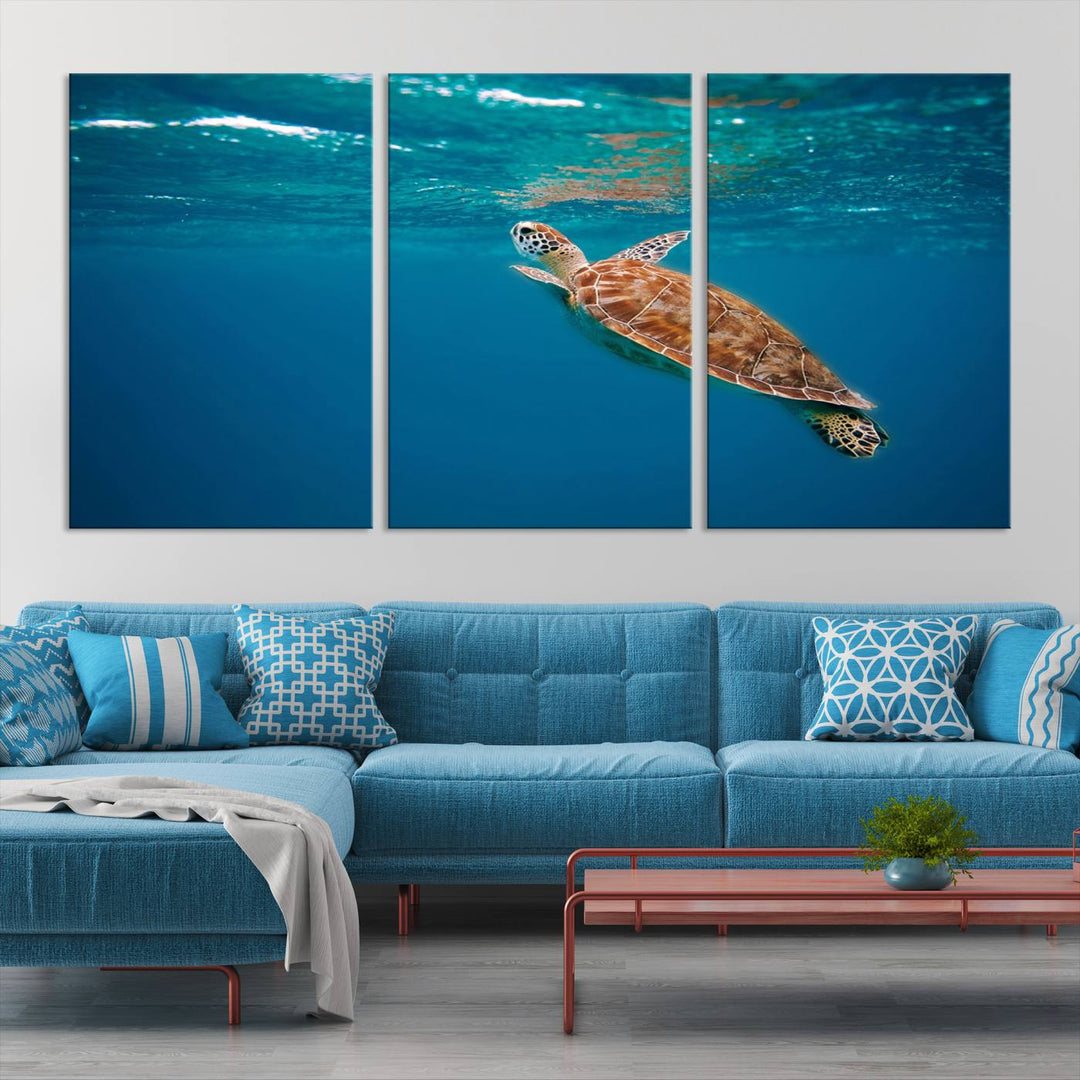 The living room features the "Baby Turtle in Ocean" wall art canvas print. This gallery-quality piece, depicting a sea turtle swimming underwater, adds an elegant touch to the space.