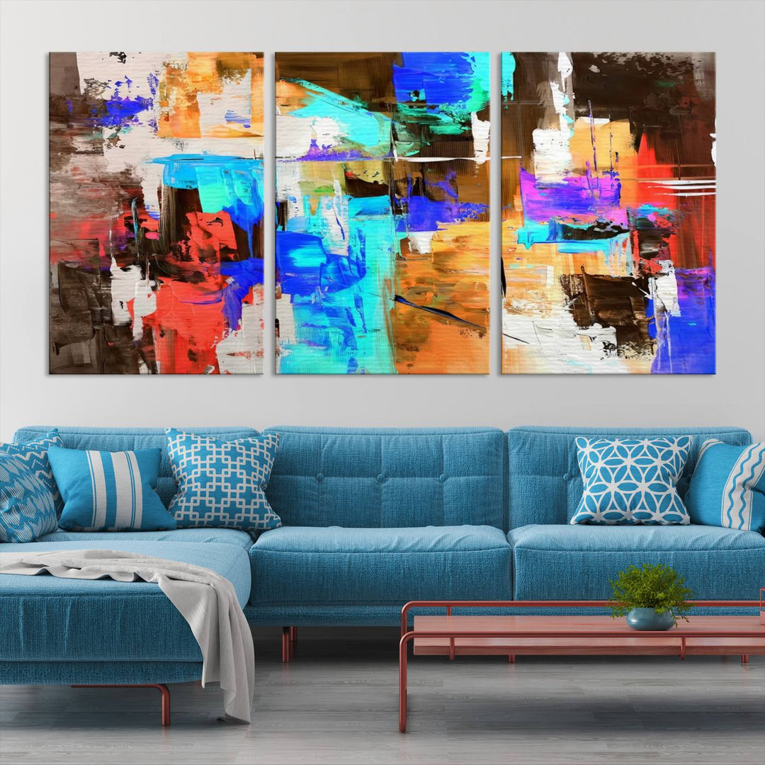 In a modern living room, the "Colorful Abstract Wall Art Canvas Print" serves as a stunning triptych centerpiece on museum-quality canvas, ready to hang. Its UV-protective coating ensures enduring vibrancy.