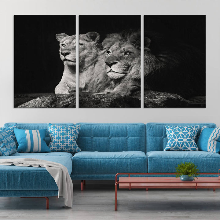 The elegant wildlife portrait, "Lion Couple Canvas Wall Art Print," featuring a black and white depiction of a lion family, majestically decorates the living room wall.