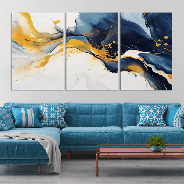 The Blue and Gold Abstract Fluid Canvas Art, with its swirling patterns, adorns the wall. This modern wall art beautifully complements the contemporary interior decor, adding an elegant touch with its rich blue, gold, and white tones.