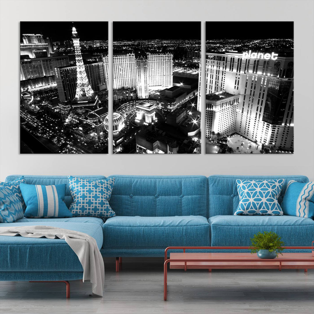 The Las Vegas Wall Art Canvas Print is a black and white triptych that showcases a city skyline at night. Crafted on museum-quality canvas with a UV-protective coating, it serves as an elegant and ready-to-hang focal point in the room.